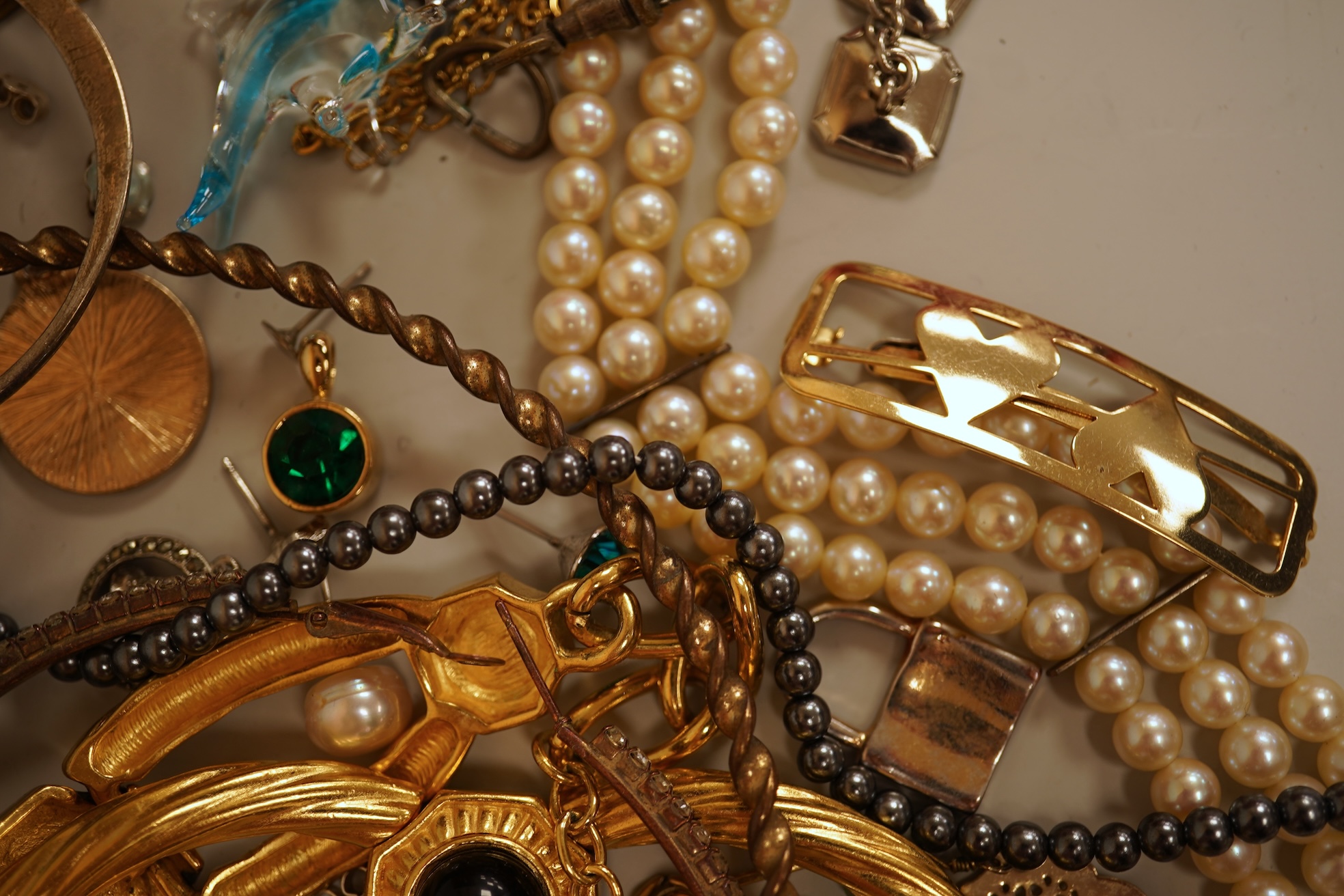 A small collection of assorted costume jewellery and other items including a cut steel shoe buckle, bracelets, chains, pair of silver and enamel oval cufflinks, etc.